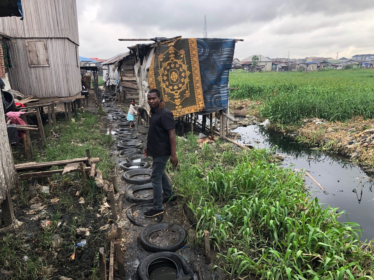 1. Approach to Vernacular Art-space Laboratory (VAL). Photo by author 2. Approach to Vernacular Art-space Laboratory (VAL). Photo by author 3. Adegbite in front of Vernacular Art-space Laboratory (VAL). Photo by author
