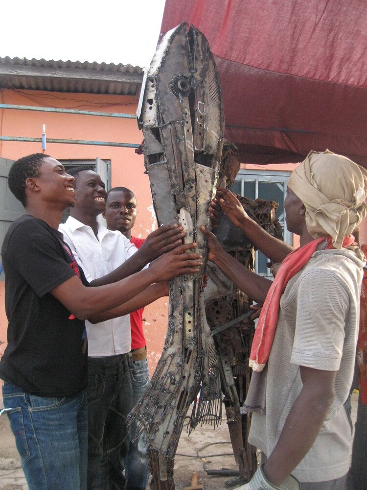 1. Artists and Busua community in the Western Region of Ghana as part of “Art in Public Spaces,” 2009. Photo: FCA Ghana Archives 2. Akanmaje community Youth work with Joseph Kola in his studio in Nungua as part of “Art in Public Spaces,” 2010. Photo: Adwoa Amoah. 3. Mural at Akanmaje as part of “Art in Public Spaces,” 2010. Photo FCA Archives.